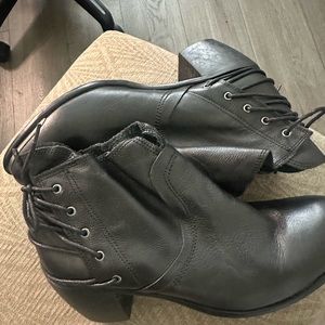 Woman’s black leather booties